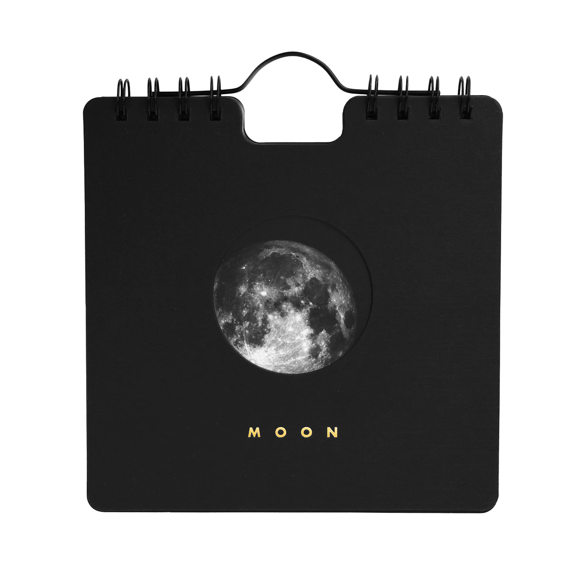 A black spiral-bound calendar with a circular moon graphic in the center and the word 'MOON' printed below in gold, shown on a plain white background