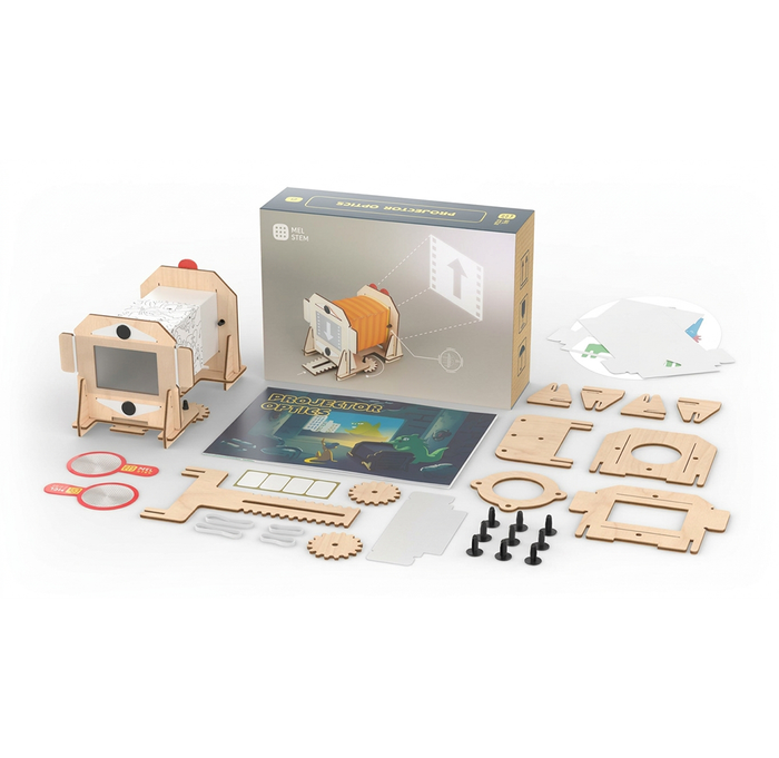 A wooden pinhole camera kit is shown assembled beside its box, instruction booklet, gears, lenses, and laser-cut parts, suggesting a hands-on, creative project.