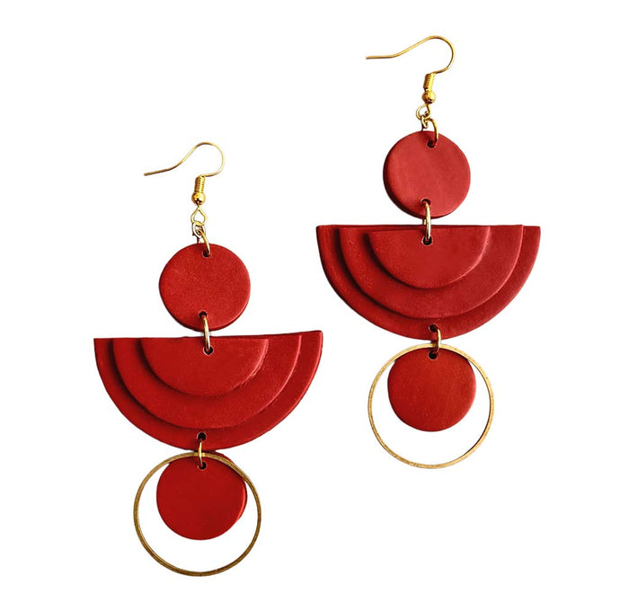 Red dangle earrings with gold hoops on the bottom and ear pieces.