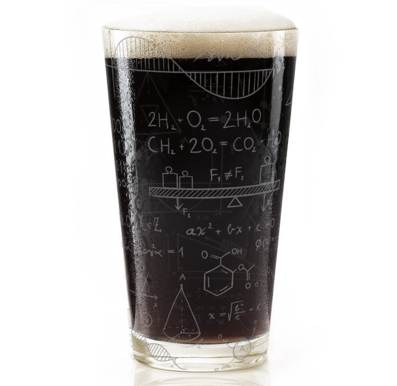 A clear pint glass filled with black stout and topped with a thick white foam head, featuring white chalk-style equations and scientific diagrams printed on the side, set against a plain white background.