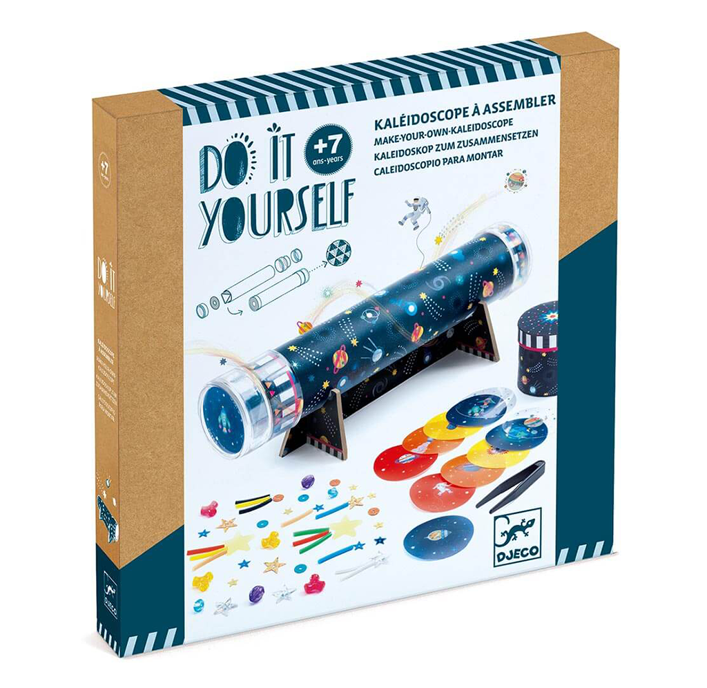 A Djeco “Do It Yourself” kaleidoscope kit box shows a starry blue telescope, colorful discs and craft pieces; playful, creative packaging for ages 7+.