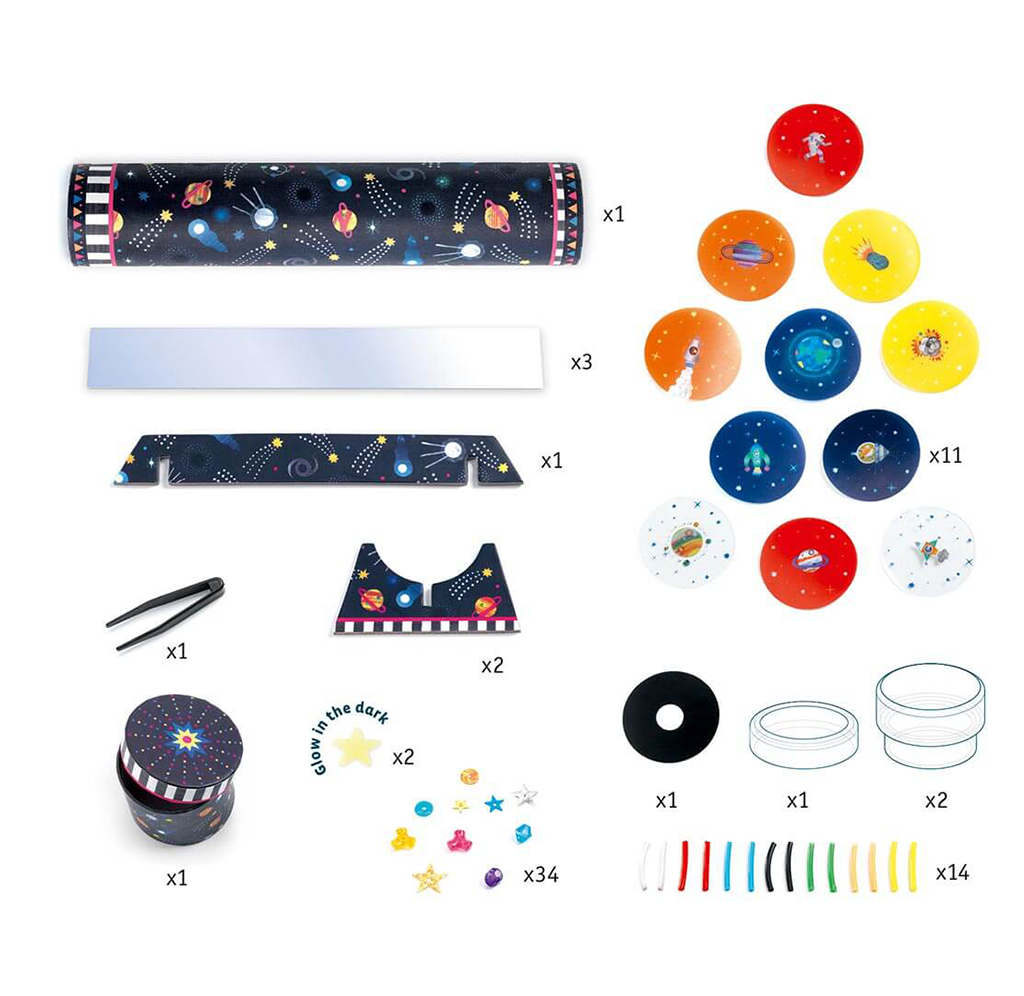Flat-lay of a glow-in-the-dark space-themed party kit: starry decorations, colorful planets, stickers, bracelets, cups, and a party hat, arranged neatly on white.
