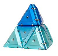 Geode chrome magnetic building triangles assembled into a pyramid, featuring translucent aqua and blue pieces with visible magnetic connectors