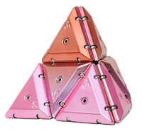 Geode chrome magnetic building triangles assembled into a pyramid, featuring translucent pink and orange pieces with visible magnetic connectors