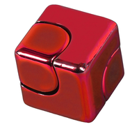 Glossy red fidget cube with rounded, clickable buttons on its front and top, shown against a white background; playful, tactile design.