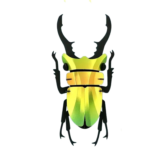 Gold an green stage beetle made out of shiny paper on the body and black paper for the legs.