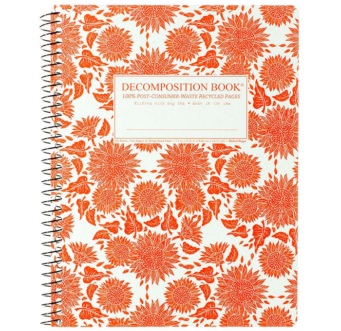Spiral notebook with reddish orange sunflowers against a white background