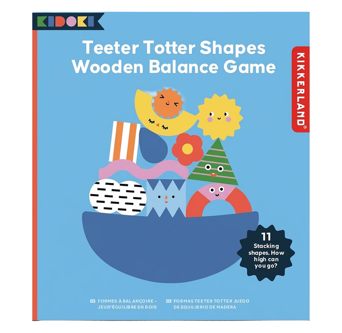 Blue packaging for a Kikkerland wooden balance game shows colorful smiling shapes stacked on a curved base, with a playful, cheerful tone.