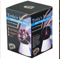 Tesla's lamp plasma ball black box packaging with a plasma ball on the front against a white background.