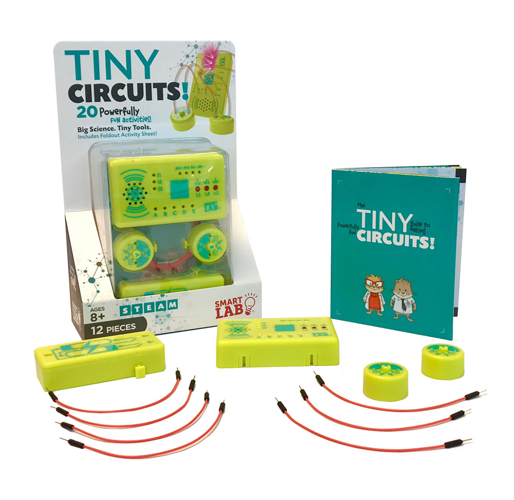 A colorful Tiny Circuits electronics kit is displayed with circuit modules, red jumper wires, a booklet, and box; playful packaging invites hands-on STEM learning.