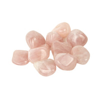 Pink tumbled stones on a white background