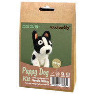 Woolbuddy Puppy Dog Needle Felting Kit in a brown kraft paper hanging bag with a green and brown front label showing a puppy dog illustration.