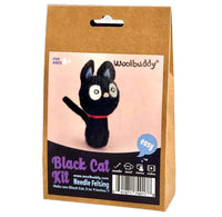 Woolbuddy Black Cat Needle Felting Kit in a brown kraft paper bag package, featuring a photo of the completed black cat pincushion on the front label.