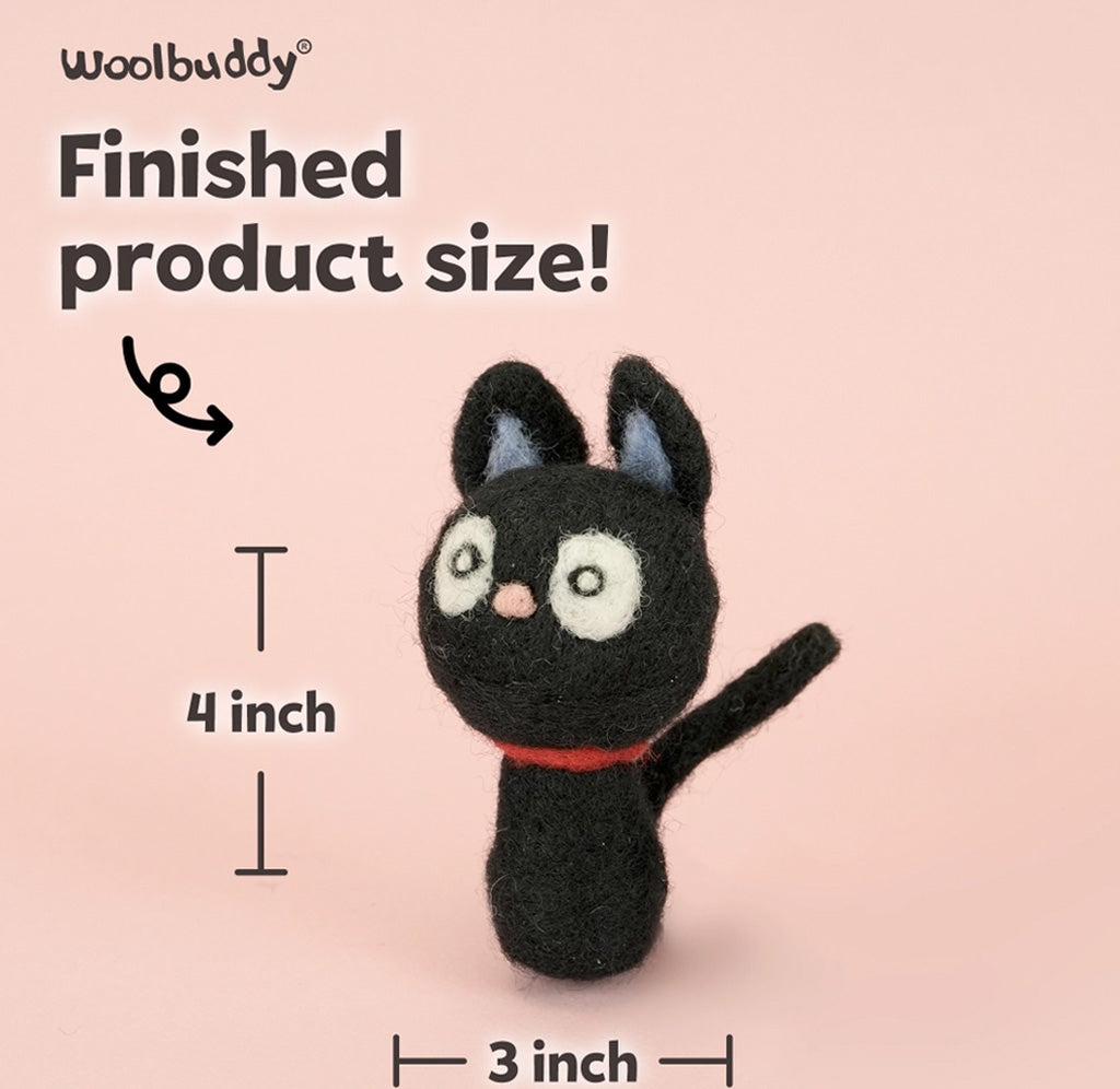 A felt needle art cat figurine on a soft pink background with text showing finished product size: 4 inch tall and 3 inch wide. The Woolbuddy brand name appears at the top.