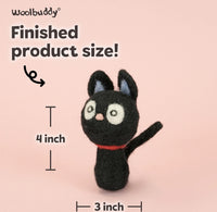 A felt needle art cat figurine on a soft pink background with text showing finished product size: 4 inch tall and 3 inch wide. The Woolbuddy brand name appears at the top.