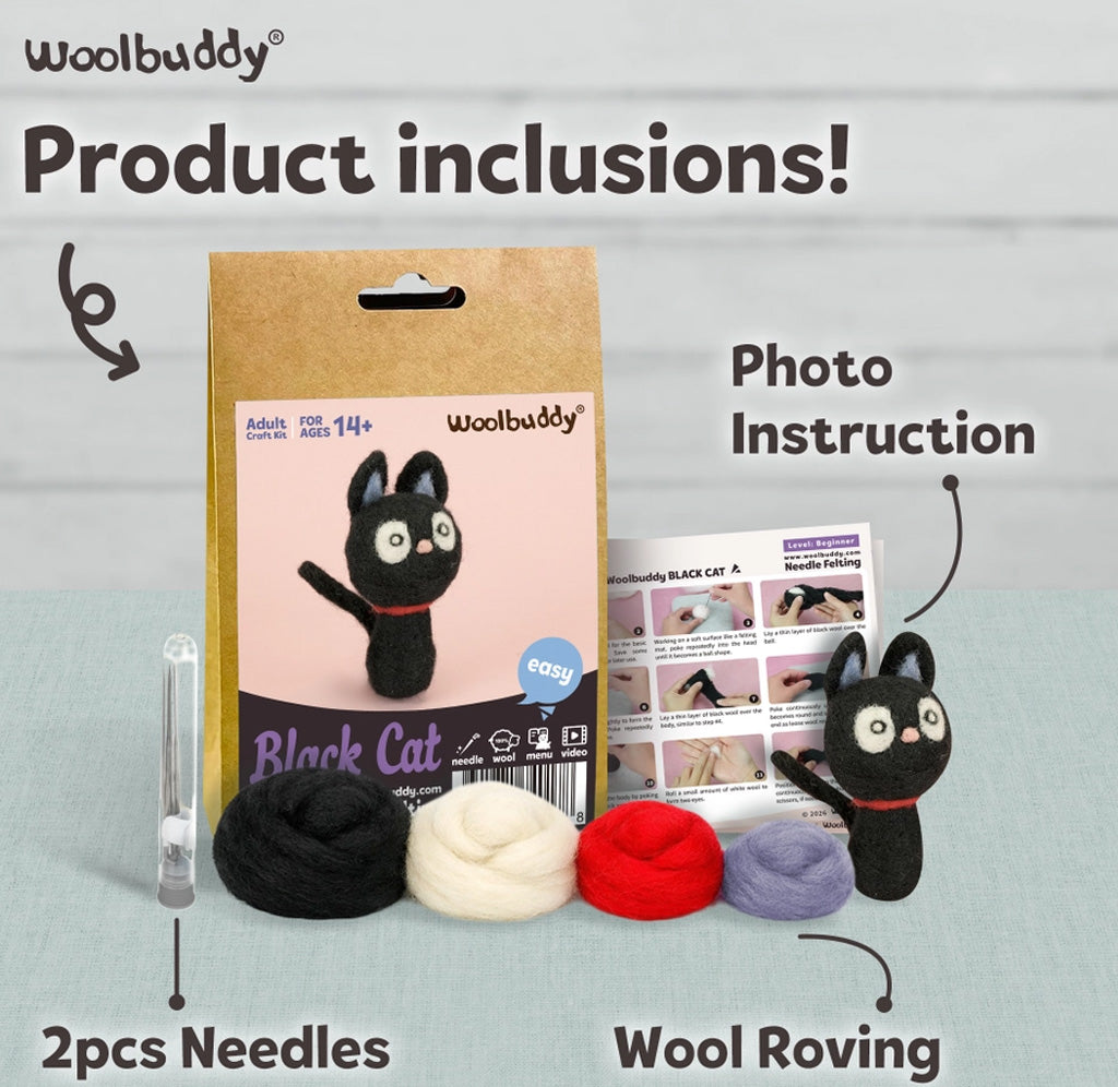 Woolbuddy Black Cat felt knitting kit shown with its kraft paper packaging, photo instruction sheet, two needles, and four balls of wool roving (black, cream, red, and lavender) on a light gray wood-textured background.
