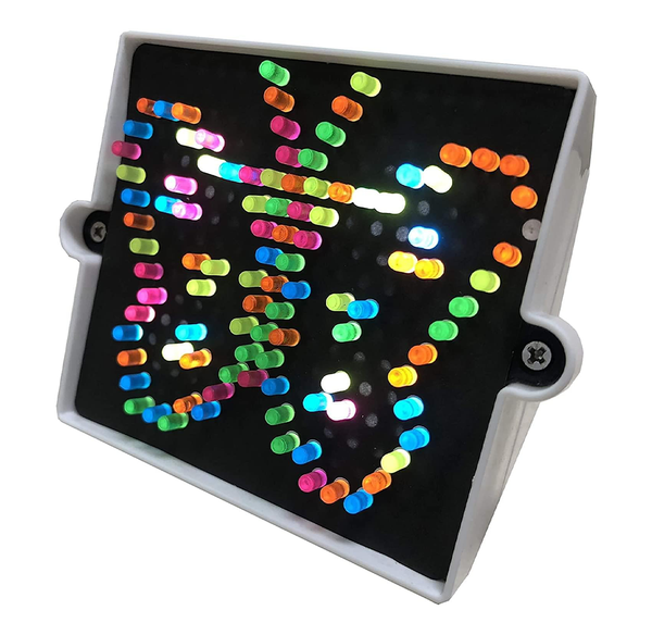 A tilted black LED light panel in a white frame glows with rows of colorful dots—red, green, blue, yellow, and pink—creating a playful, vibrant display.