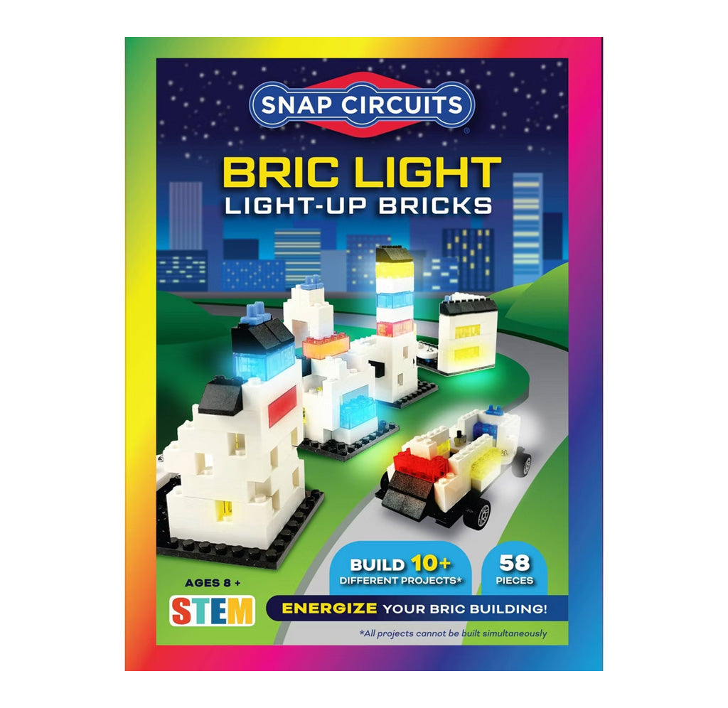 Snap Circuits Light-Up Bricks packaging with colorful design and toy bricks on a cityscape background.