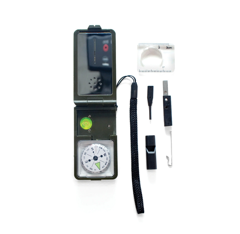 A tool is shown open, revealing a compass inside and various parts and other tools next to it. 