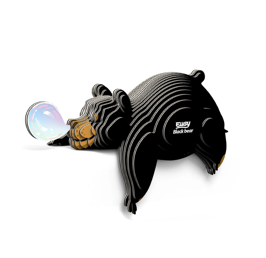 Black bear-shaped puzzle with a rainbow bubble on a white background