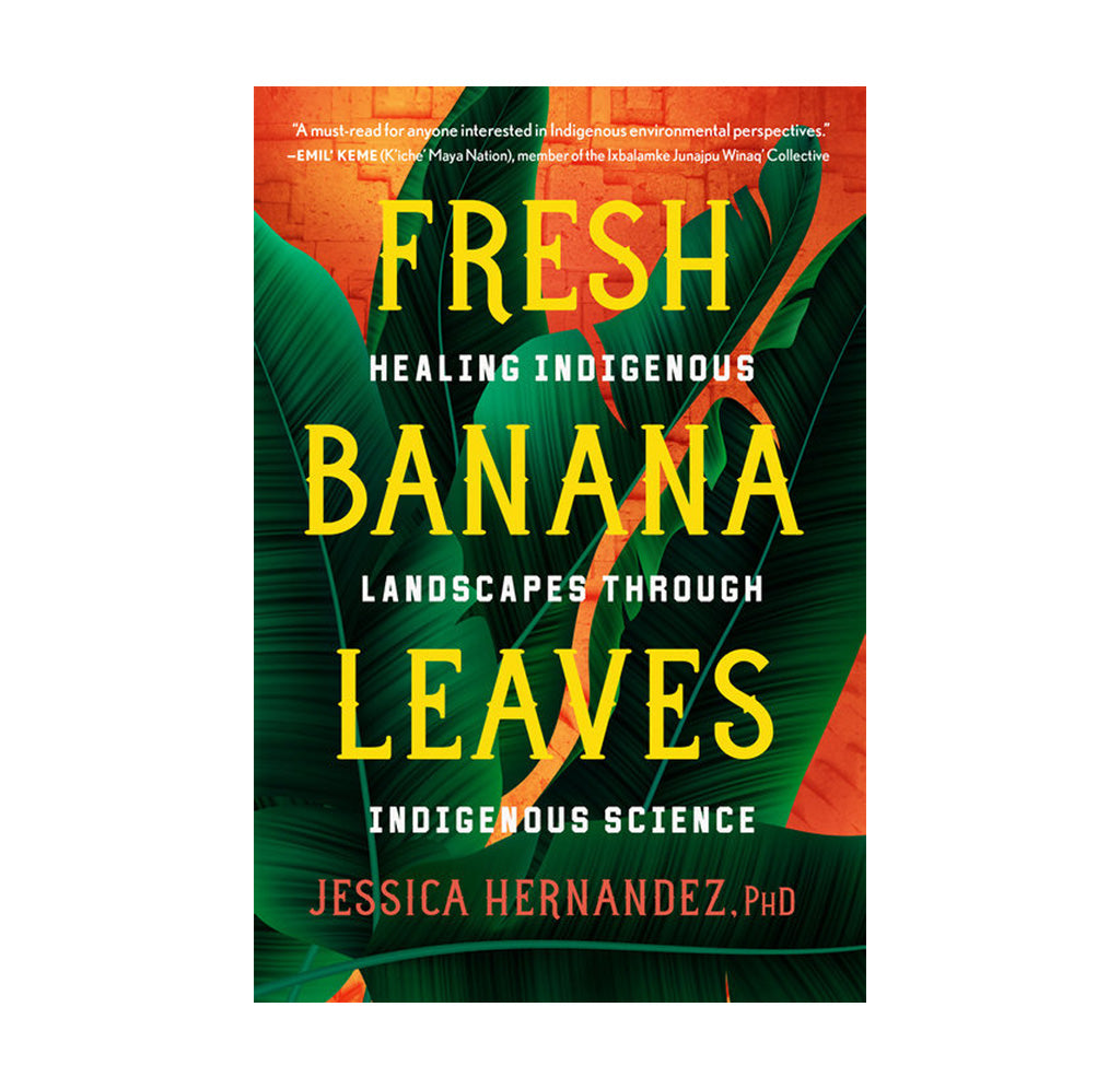 A orange cover with images of green banana leaves on the front. 