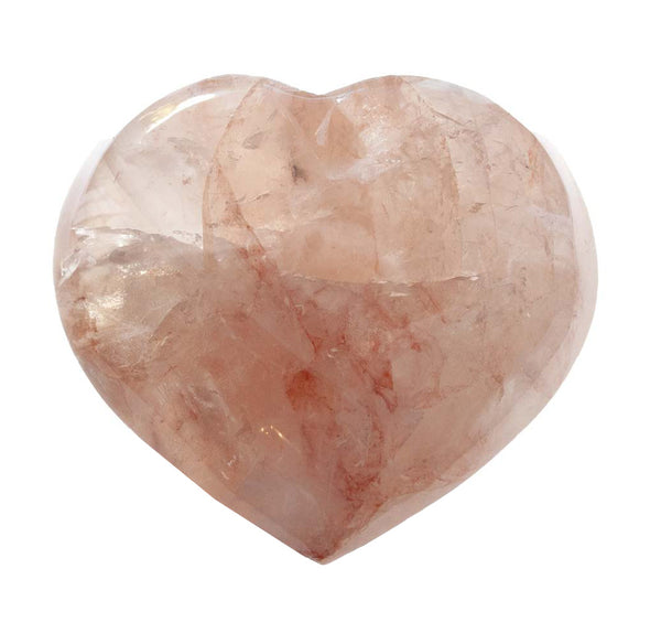 Heart-shaped pink stone on a white background