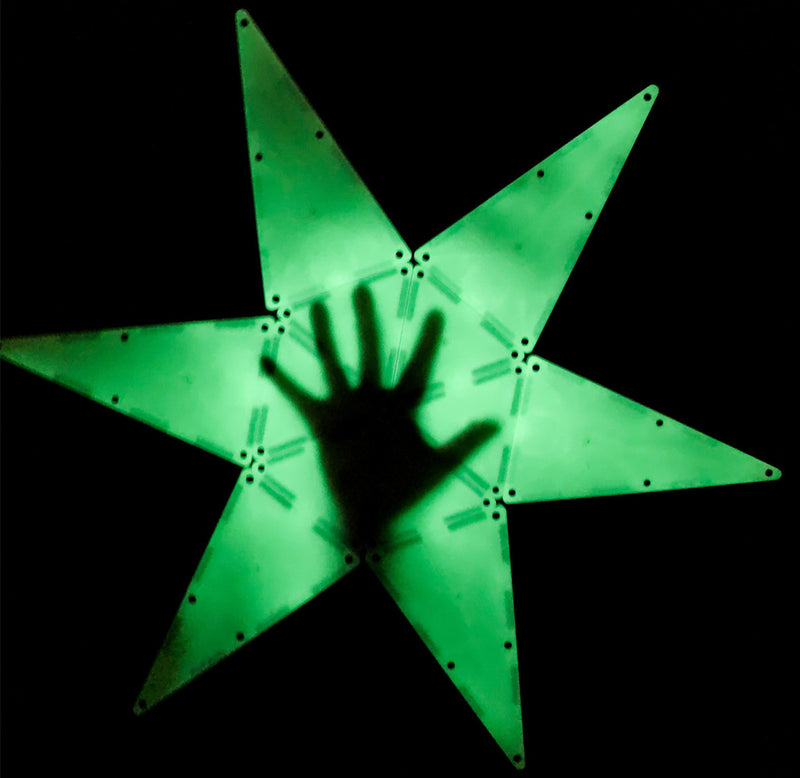 A 6 pointed star made of triangles with a shadow of a hand in the middle
