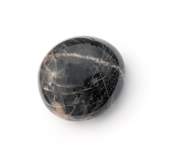 A smooth black pebble with lines of pink and cream color. 