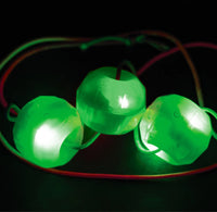 Green glowing lights on a black background