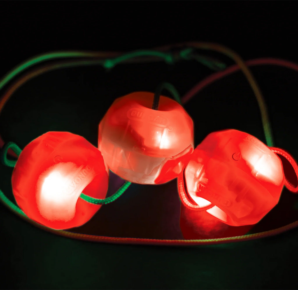 String of red light bulbs on a black background