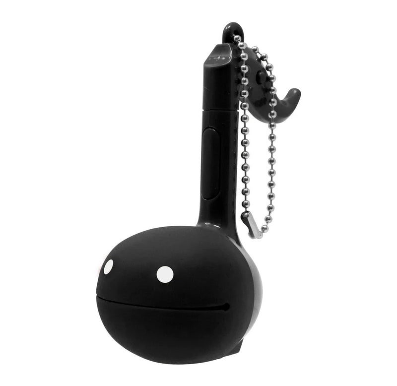 A black music note shaped toy with a metal keychain attached. 
