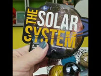 video of person showing the solar system marble bag. 