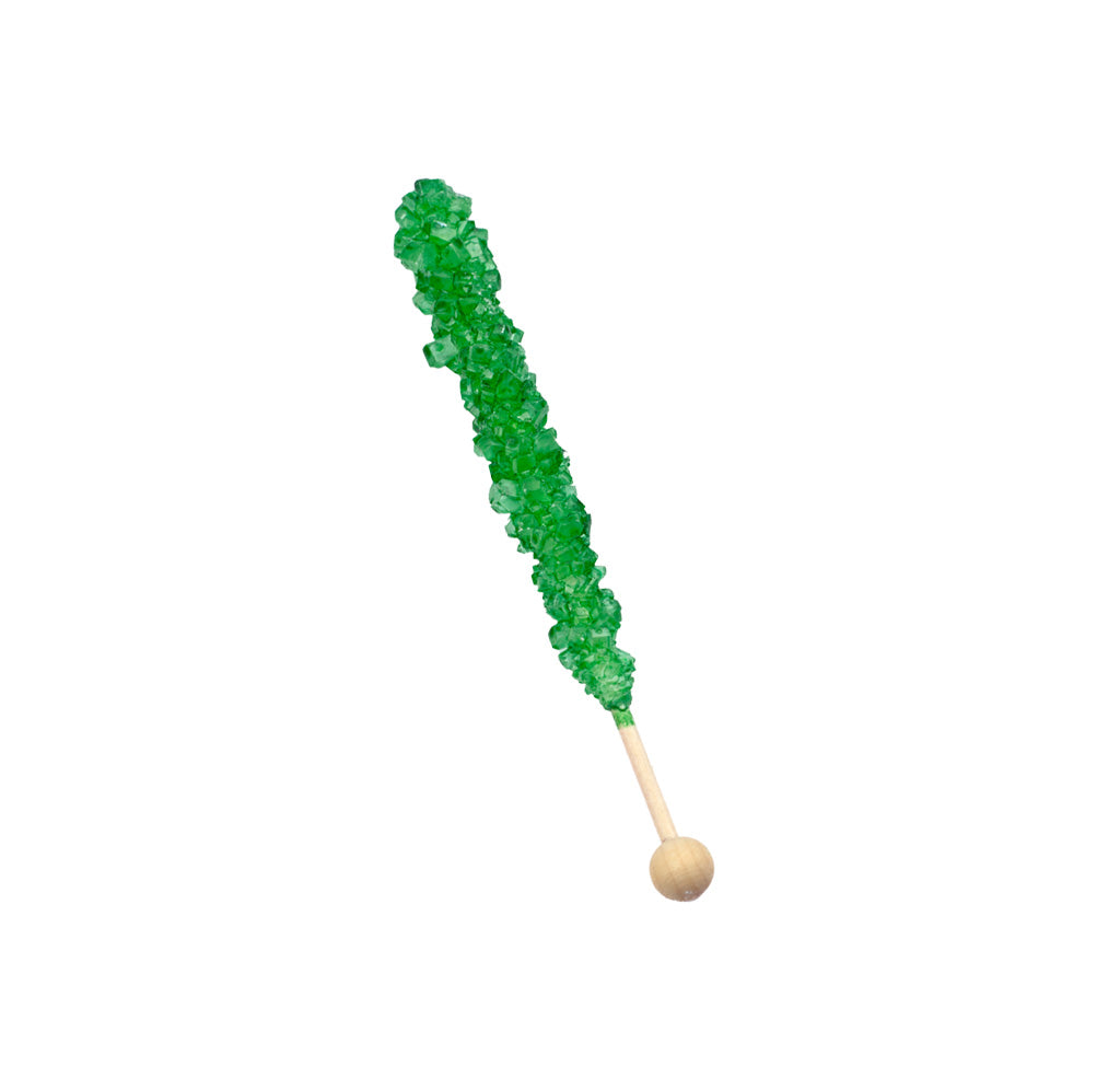 Green rock candy on a wooden stick against a white background