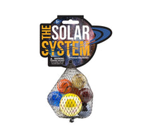 Packaged toy set labeled 'The Solar System' with colorful marbles in a net on a white background