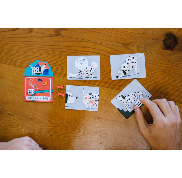 Card game with animal cards and dice on a wooden table