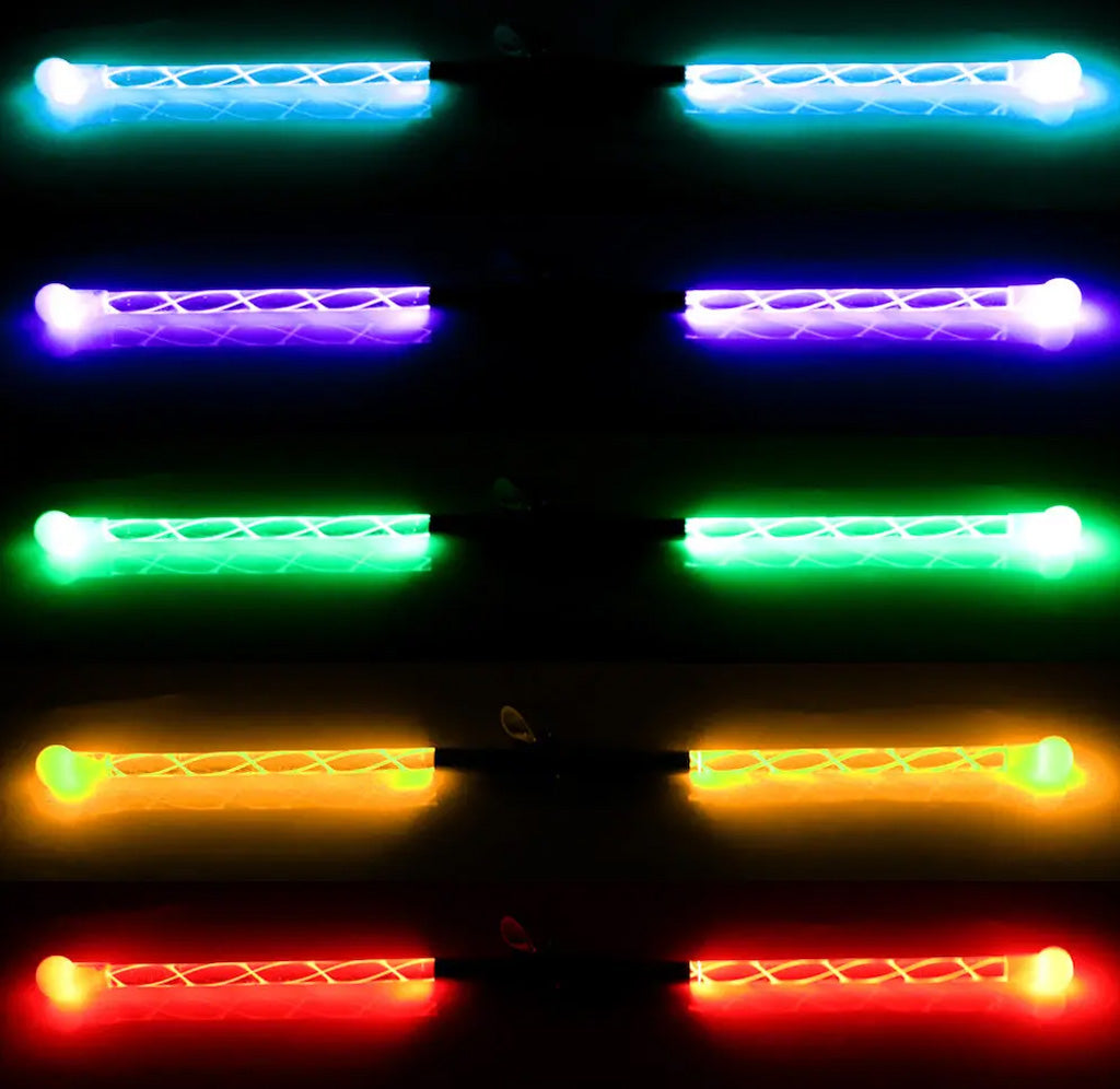 Set of colorful LED light sticks on a dark background