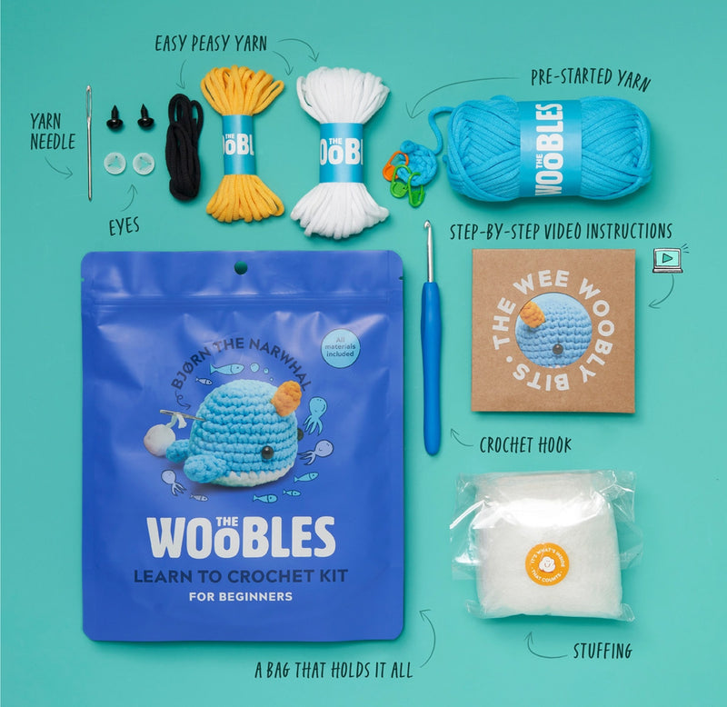 Crochet kit with yarn, needle, eyes, crochet hook, and packaging on a teal background