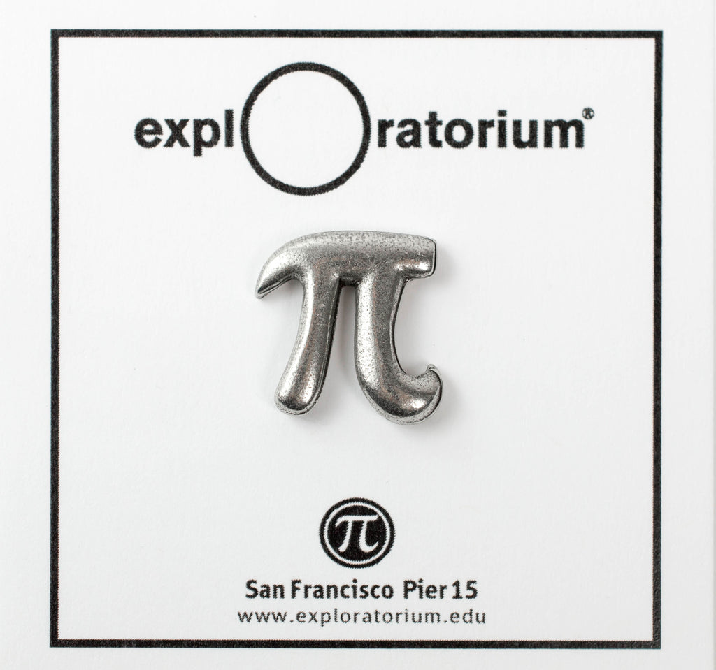 A fine pewter pin in the shape of the Pi symbol on a white card with Exploratorium on the top in black.