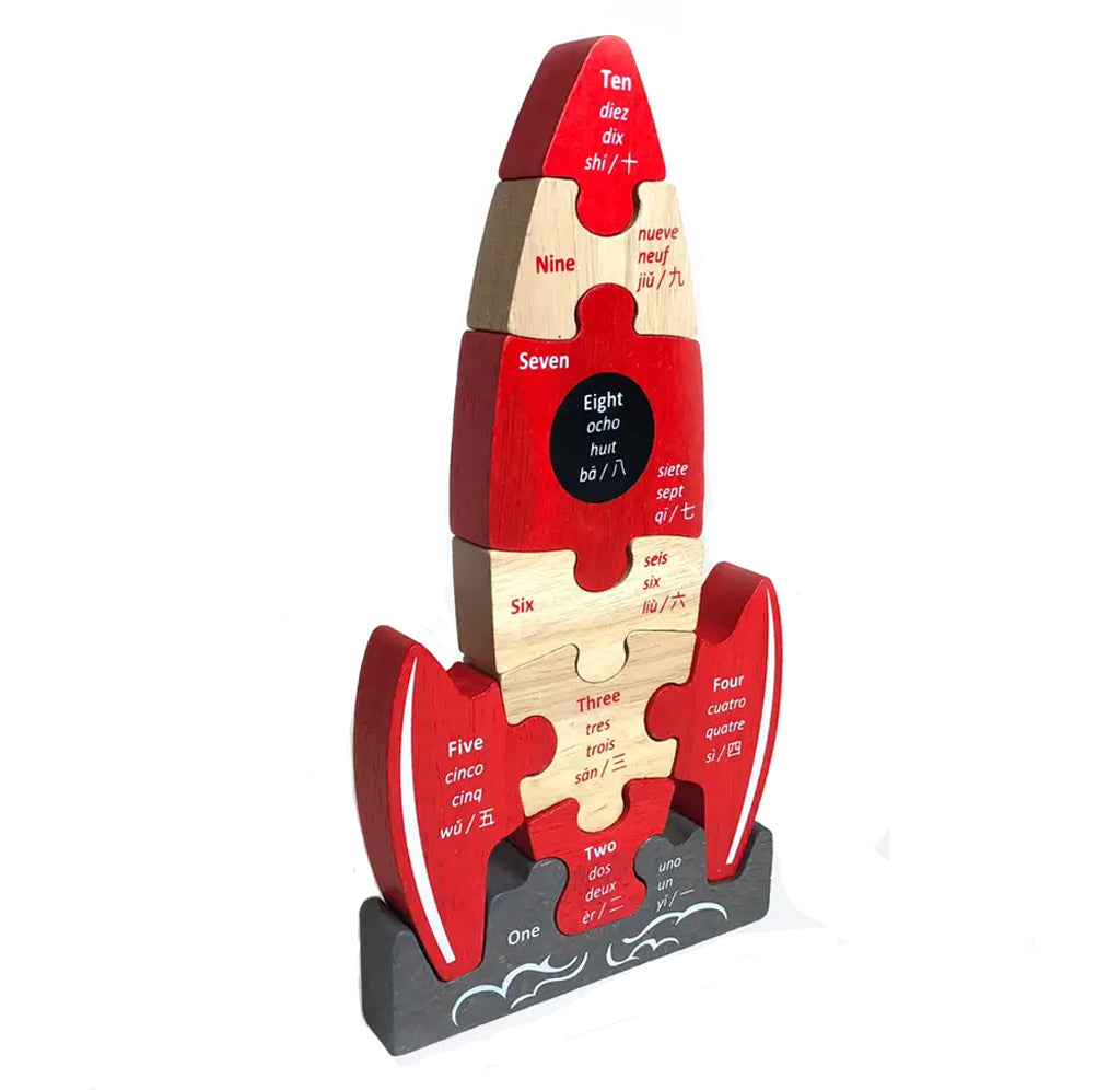 Side view of wooden rocket ship puzzle. Count down in Englsih, Spanish, French and Chinese