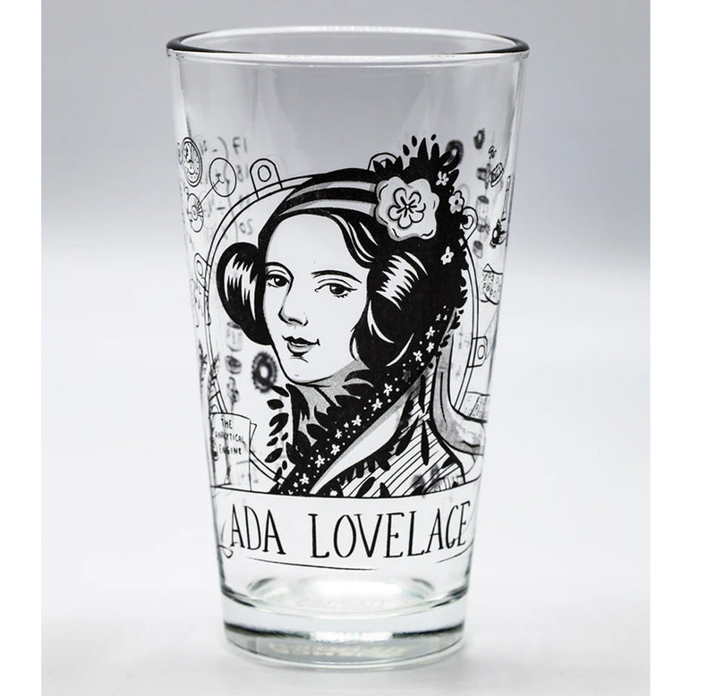 A 16oz pint glass with an image of Ada Lovelace with math symbols around the outside printed in black. 