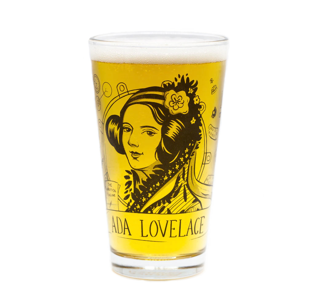 A 16oz pint glass with an image of Ada Lovelace with math symbols around the outside printed in black. A golden beer fills the clear glass to show contrast against the black printed sections.