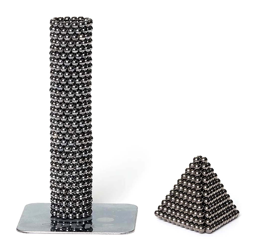 A cylindrical tube and small pyramid in the black Luxe Speks.