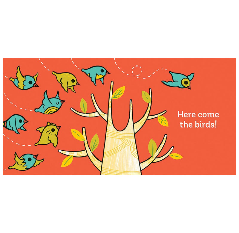 This is a layout page from the book. "Here comes the birds"  Eight yellow and blue birds fly over to sit in the branches of the beige tree with green leaves. The background is orange.