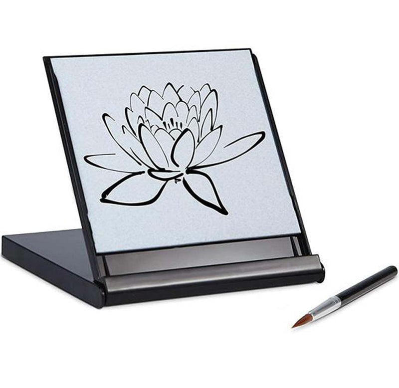 This is a 5" x 5" square kit that folds out onto itself. This acts as its easel. The top hlf has a was sensitive material that can be made wet over and over again. There is a lily flower drawn on the surface. A paintbrush rests on the side.