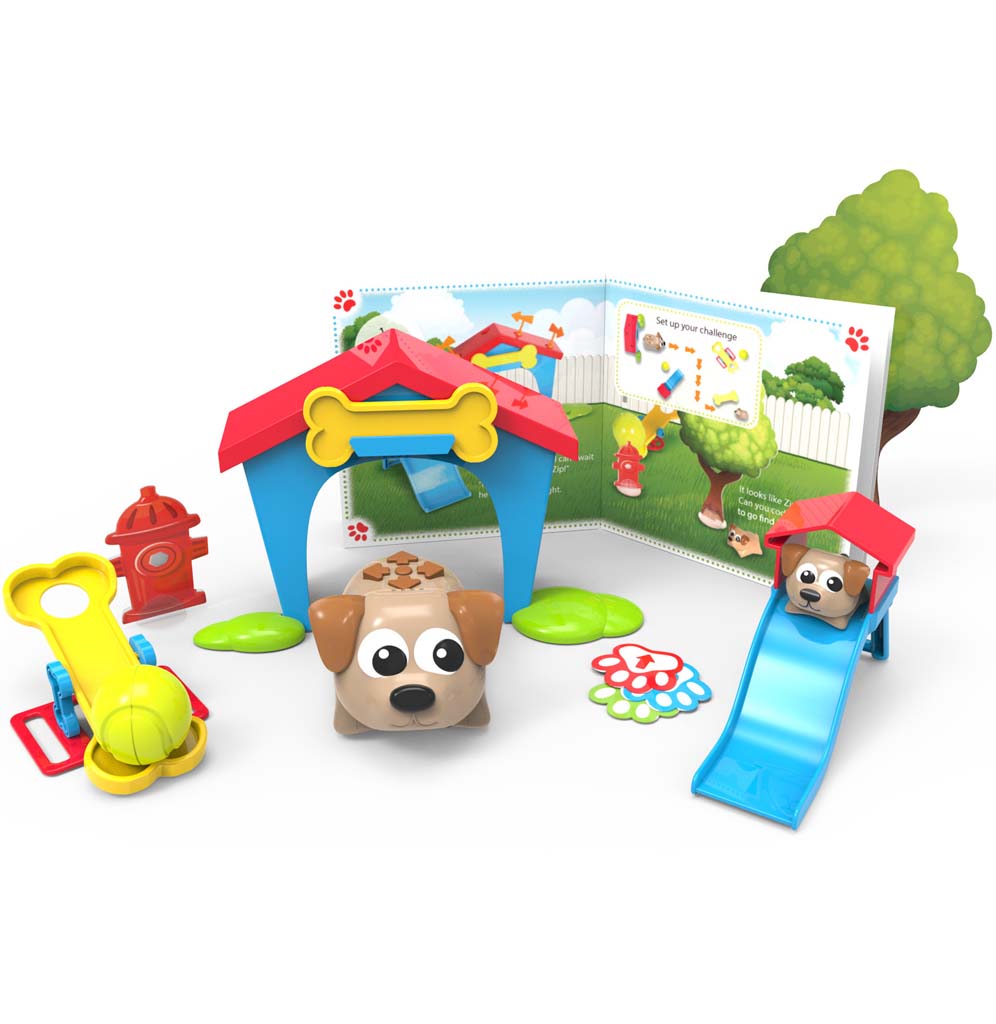 A playset is set up for the two brown dogs to interact with a slide, a teeter-totter, and a dog house.