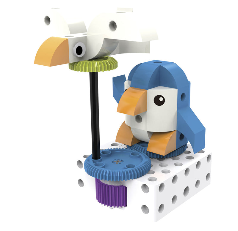 The blue and white penguin coding robot sits on top of a white ice cube with a white bird in the sky to its left.