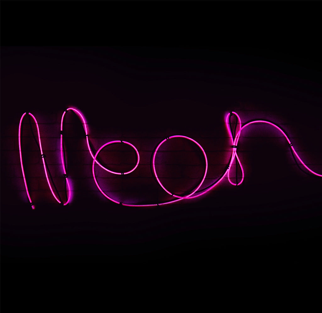 The word neon in pink neon Flexi wire against a black background.