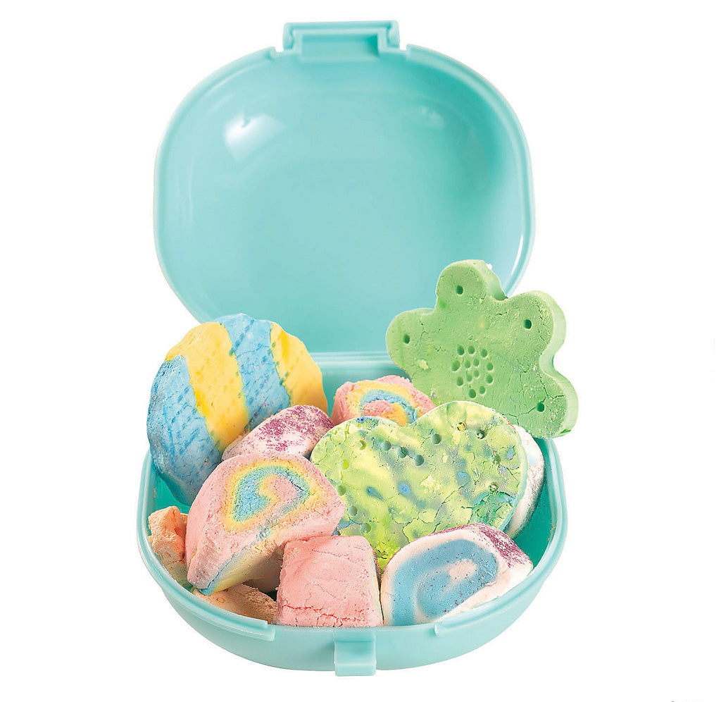Turquoise container filled with different shaped bubble dough.
