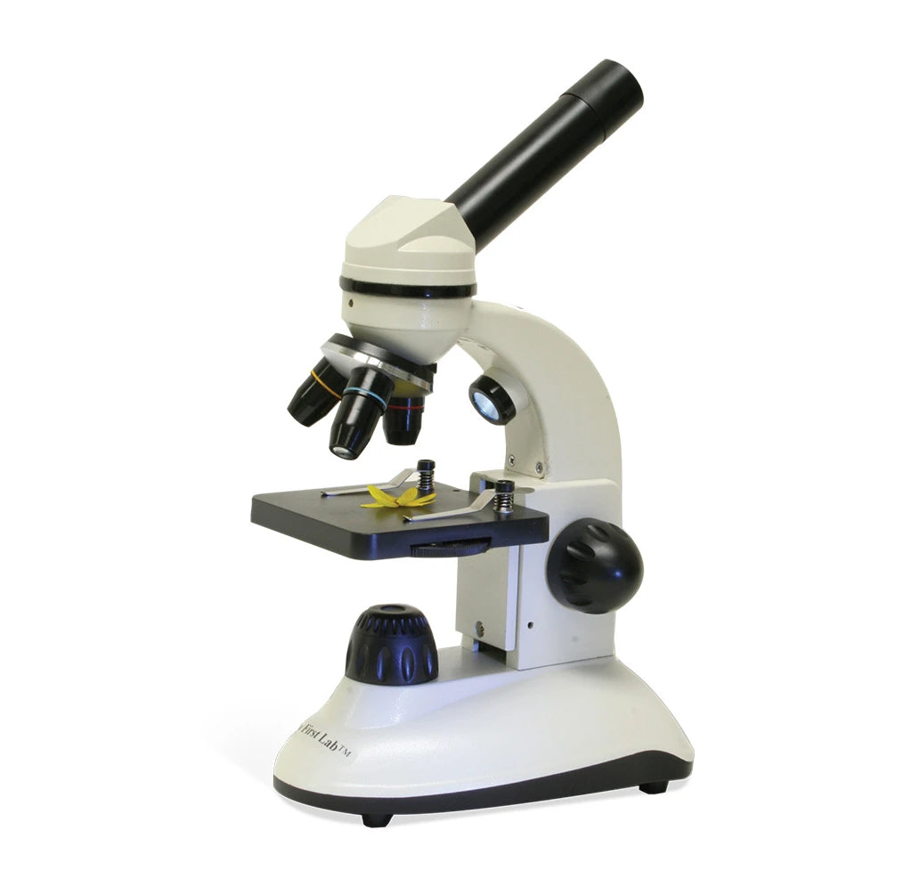 The microscope is 5.1 x 6.1 x 12.2 inches in dimension. It has a white body with black turning knobs, eyepiece, magnifying glass lenses, and a slide mount. 
