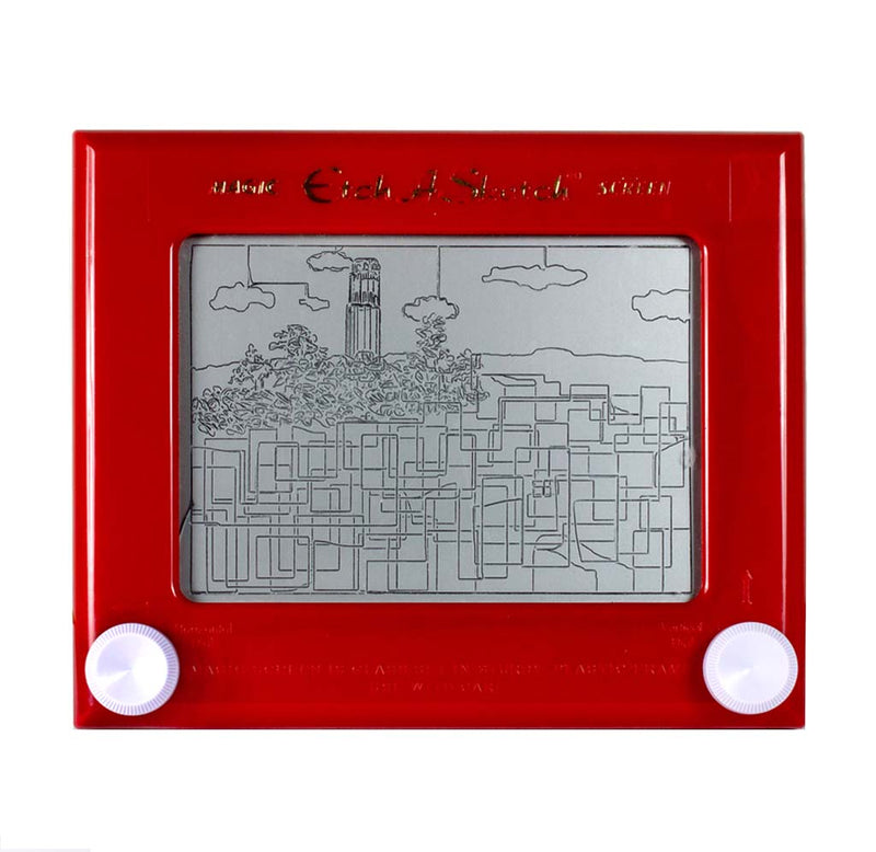 A red frame surrounds a grey surface with what looks similar to a line drawing of a San Francisco landscape. Two white knobs at the bottom are used to draw.